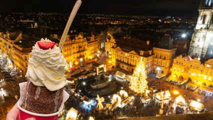 Prague, Eating Trdelnik, Old Town Square seen from above at Christmas time.