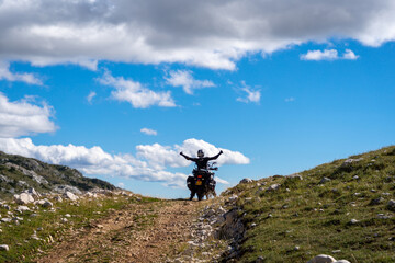 Young man on a motorbike happy and proud of his accomplishment in riding off-road