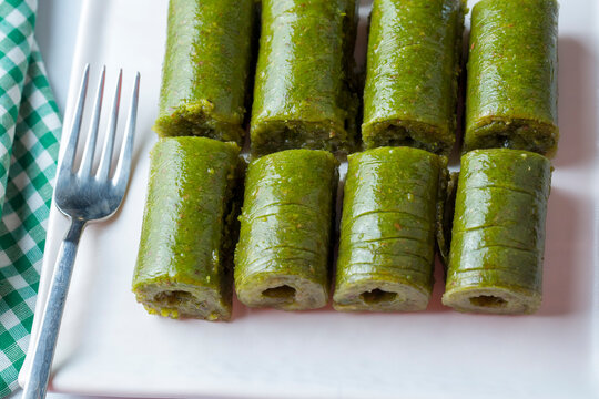 Pistachio baklava. Traditional Middle Eastern Flavors. The local name of Baklava is Fıstıklı Baklava or fıstıklı dolama. Turkish style pistachio baklava presentation and service