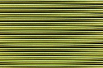 Seamless texture of green siding abstract building materials in horizontal lines, background