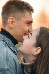 stunning sensual young couple in love posing at the sunset, happy lifestyle concept