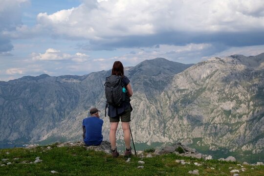 Silhouettes of people on top in mountains. Mountain views on the route from Kotor to the Vrmac Peninsula, with the highest peak Sveti Ilija. Montenegro, Balkans