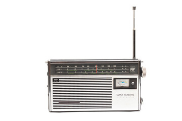 Old transistor radio isolated on white.