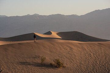 Fototapeta na wymiar Woman overlooking the landscape in the desert