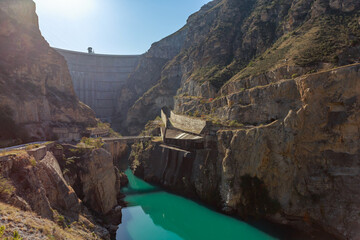 View of the high concrete dam from the bottom.