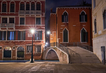 Night view from Venice a couple sitting under street light