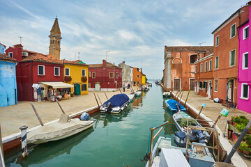 Fototapeta na wymiar Colorful houses on the canal in Burano island, Venice, Italy.