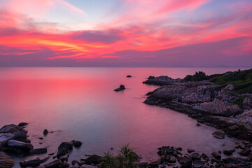 Seascape with natural stone arch at sunset in Ko Man Klang, Rayong