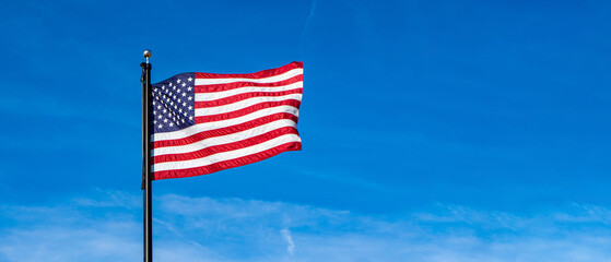 American Flag Waving in Wind on Blue Sky, Background, Memorial Day