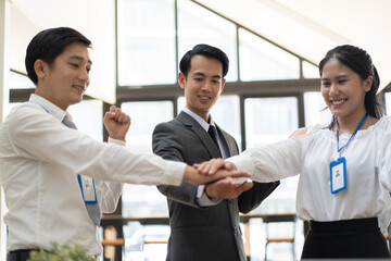 young business people putting their hands together. Stack of hands. Unity and teamwork concept.