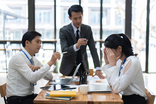 Conflict Between Business Workers At Workplace, Female Businesswoman Is Being Threaten By Her Coworkers.