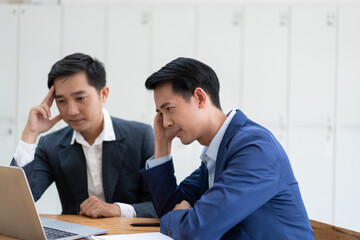 Team of business people feeling stressful and upset, receiving the bad news.