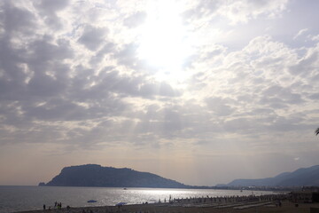 Evening, Alanya, sunset over the sea and mountains, beautiful clouds.