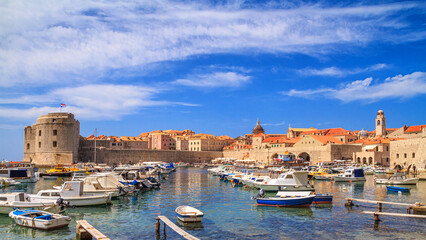 Fototapeta premium Coastal summer landscape - view of the City Harbour and marina of the Old Town of Dubrovnik on the Adriatic coast of Croatia