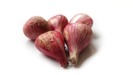 Bawang Merah or Shallots or Red Onion on bamboo basket isolated on white background