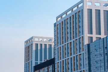 cityscape, urban background, group of facades of modern high-rise buildings against the sky © Evgeny