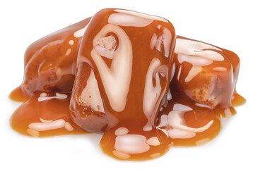 Caramel candies covered with melt caramel isolated on white background.