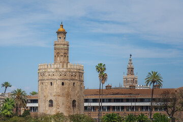 Fototapeta na wymiar Torre del Oro (Golden Tower) and Seville Cathedral Tower - Seville, Andalusia, Spain