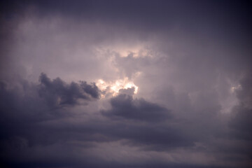 Naklejka na ściany i meble Before storm. Sun and clouds.