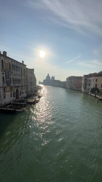 Vertical Video of a Beautiful Sunrise in One of the Famous Canals of Venice, Italy.