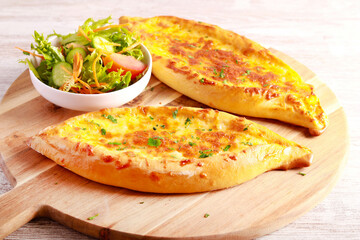 Cheese boat, crusty bread with melted cheese