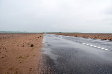 Road to Holy Island in England leading to the seabed.