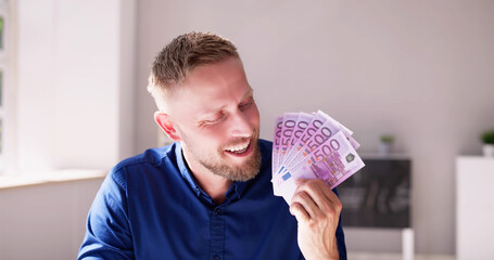 Man Holding Euro Paper Money