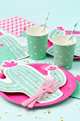 Cute paper party plates in the shape of cactus with cups for themed party. Hawaiian Birthday party...