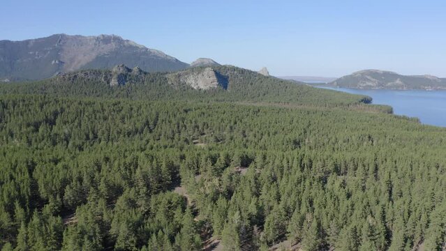 Aerial drone footage of rock remnant near the Lake Great Chebachye Lake in Natonal park Burabay Borovoe , Kazakhstan