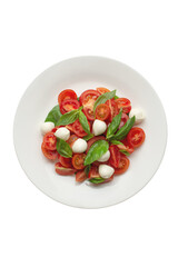 Salad with cherry tomatoes and mozzarella in a white plate