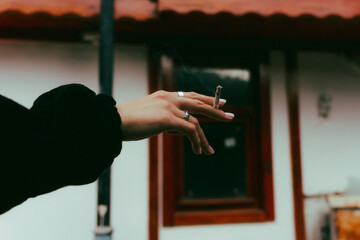 hand with a cigarette