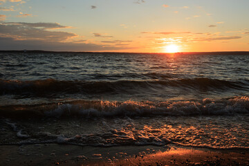 Evening landscape, sunrise or sunset on the lake or the sea