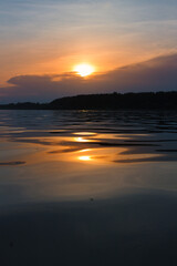 Fototapeta na wymiar Evening landscape, sunrise or sunset on the lake or the sea