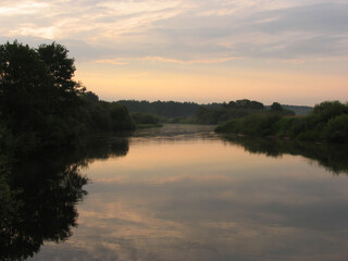 Evening landscape, sunrise or sunset on the lake or the sea