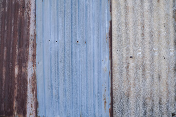 old wooden wall. tin roof on the walls. Old zinc wall texture background, rusty on galvanized metal...