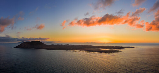 Beautiful warm sunrise mid level aspect aerial image over the island of Lobos near Corralejo in Fuerteventura Canary Islands Spain