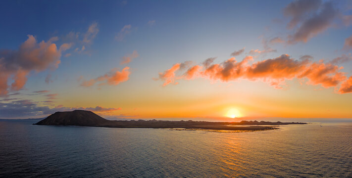 Beautiful warm sunrise mid level aspect aerial image over the island of Lobos near Corralejo in Fuerteventura Canary Islands Spain