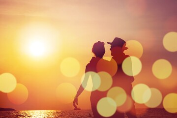 Silhouette sunset : Senior business man and his wife walking on the beach sunset ,Silhouette...