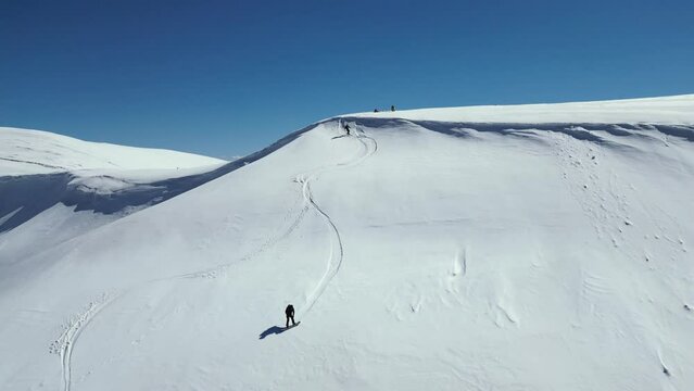 Snowboarding in the snowy mountains. Winter freeride extreme sport. Freeride, two riders snowboarding downhill
