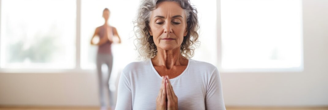 Mature woman meditating sitting in a yoga studio. Generative AI
