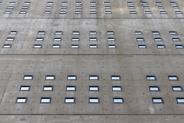 wall with small windows of a concrete building