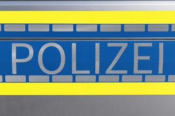 writing of the German word of police on a German police car
