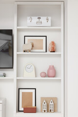 Fototapeta na wymiar Shelves with different decor indoors. Interior design
