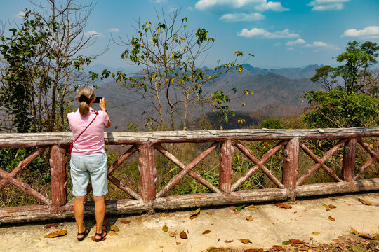 Woman Taking Photograph Of The Shan Hills,