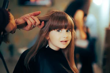 Fotobehang Little Toddler Girl Ready to Have her Hair Cut in a Salon. Happy child getting her hair professionally cut by a hairdresser   © nicoletaionescu