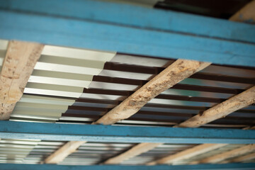 Roof from inside. Ceiling details. Chipped roof.