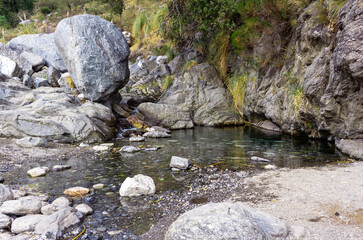 Rocky landscape in a crystal clear stream. Arroyo Pasos Malos, in the province of San Luis, Argentina.