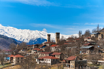 Fototapeta na wymiar Landscape view of the town of Mestia in the Sakartvelo Mountains. The famous towers of Svania