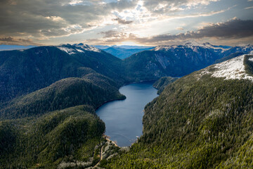 Naklejka na ściany i meble Majestic Fjord: Serene Alaskan Lake Embraced by Mountains