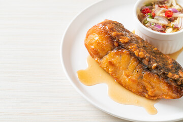 fried snapper fish with fish sauce and spicy salad